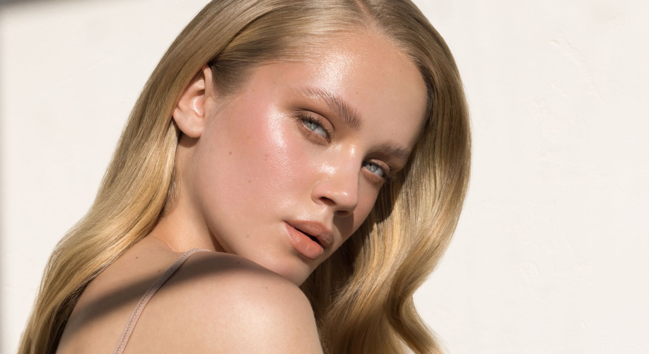 Close-up of a young woman with blonde hair.